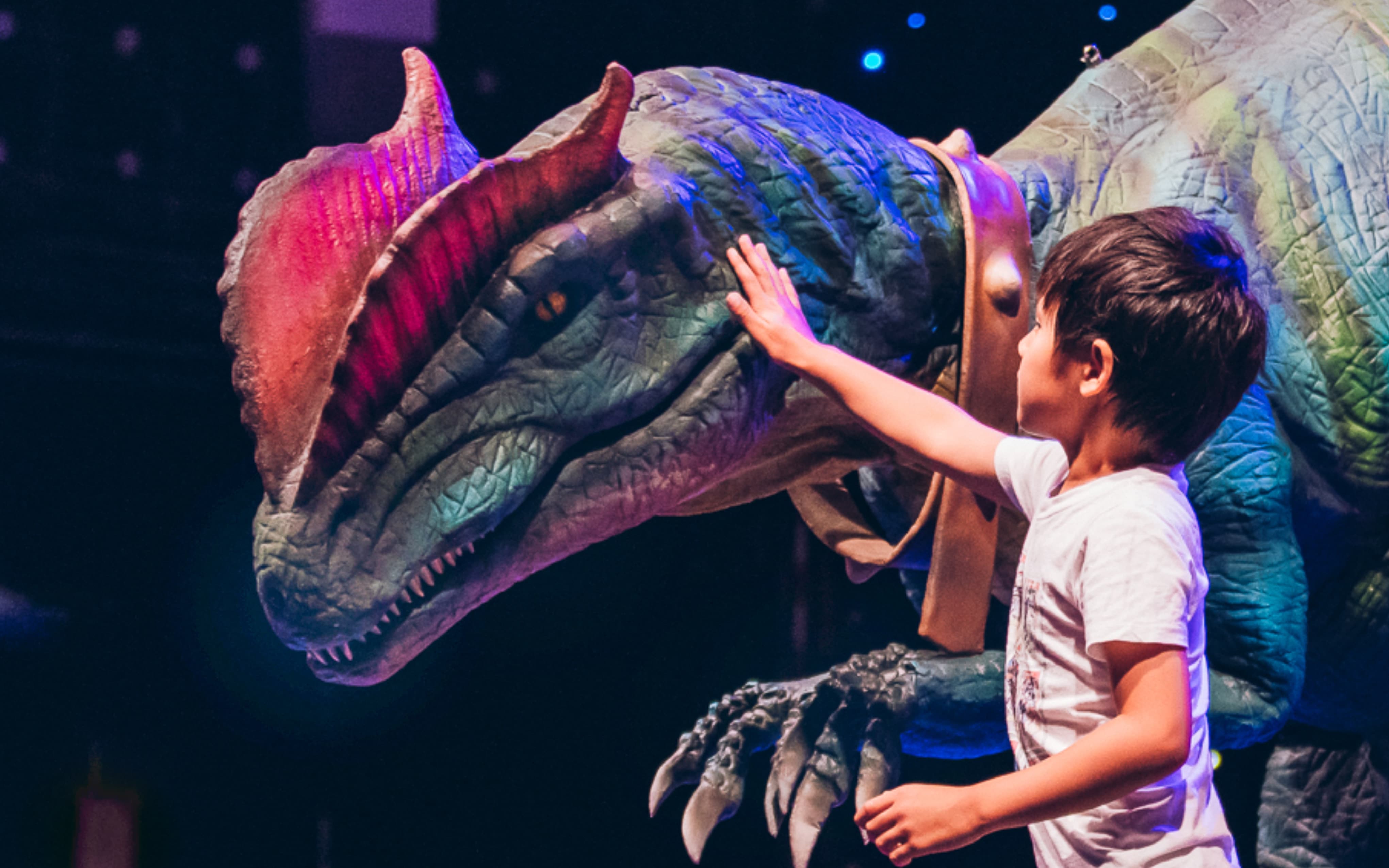 Interactive dinosaur entertainment at festival.